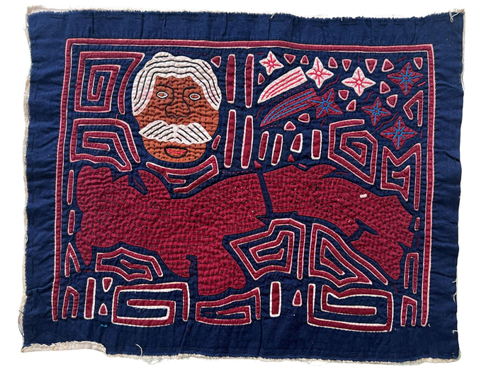 Vintage Mola cloth handmade by the Guna (previously spelled Kuna) people of the San Blas Islands.  Mola is a reverse appliqué technique, similar to the technique used iof different-colored cloth that are first sewn together before a design is created by cutting away different layers. These cloths are traditionally made in pairs to be worn on the front and back of women's blouses.  This Mola features a map of Panama and Panama's first President, Manuel Amador Guerrero.