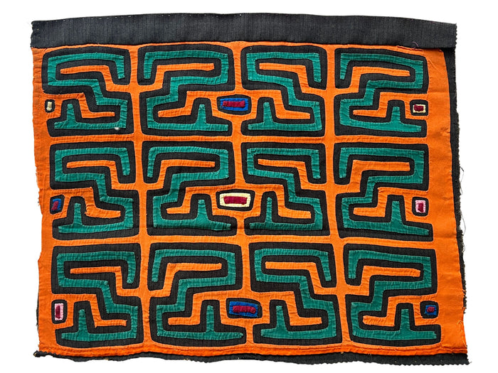 Vintage Mola cloth handmade by the Guna (previously spelled Kuna) people of the San Blas Islands.  Mola is a reverse appliqué technique, similar to the technique used in quilting but&nbsp;using multiple layers of different-colored cloth that are first sewn together before a design is created by cutting away different layers. These cloths are traditionally made in pairs to be worn on the front and back of women's blouses.  This Mola features a rooster.